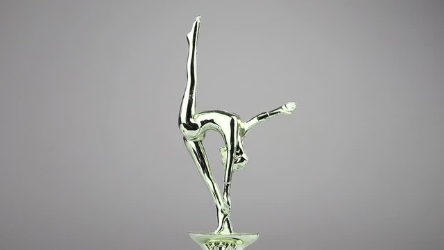Cup of the winner of sports competitions in gymnastics. the Golden statuette of a gymnast or acrobat rotates.