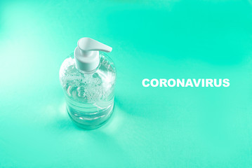 Container with alcohol gel on the light blue background