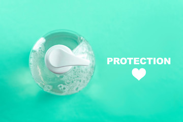 Container with alcohol gel on the light blue background