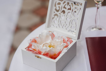 Wedding rings close-up in a beautiful box, during the bride's gathering. Accessories