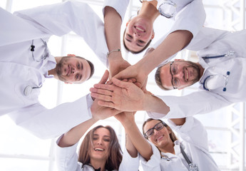 Obraz na płótnie Canvas group of diverse medical professionals showing their unity.