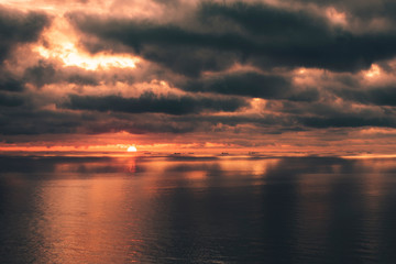 sunrise with beautiful clouds on the sea with ships