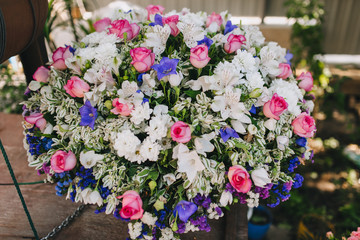 A large bouquet of multi-colored different flowers close-up: wildflowers, roses, chrysanthemums, petunia. Photography, concept.
