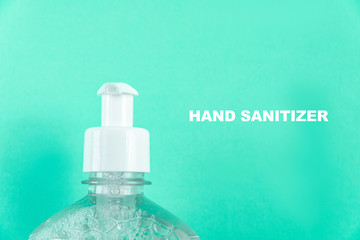 Container with alcohol gel on the light blue background