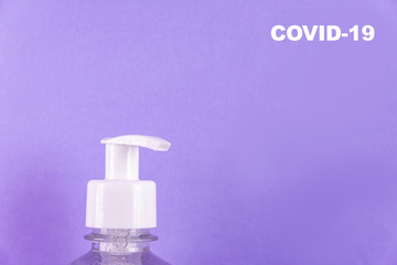 Container with alcohol gel on the light blue background