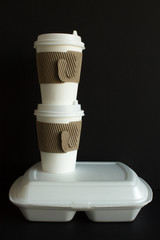 Fototapeta na wymiar Coffee in disposable cups with a lid and a container with food to take away. Concept delivery.