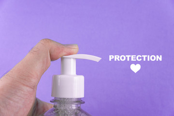 Man hand in container with alcohol gel on the light blue background