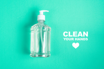 Container with alcohol gel on the light blue background