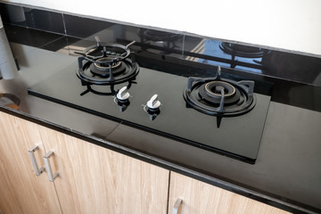 Photo of street kitchen room with black gas stove
