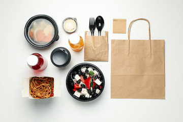 Flat lay with takeaway food on white background. Food delivery