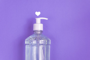 Container with alcohol gel on the light blue background