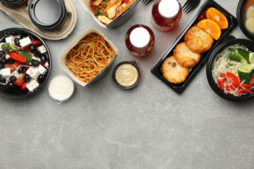 Food delivery. Food in takeaway box on gray background