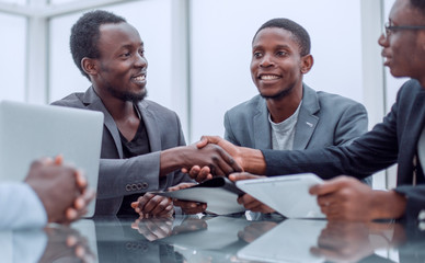 business partners greeting each other with a handshake.