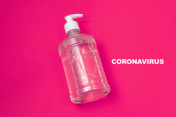 Container with alcohol gel on the orange background