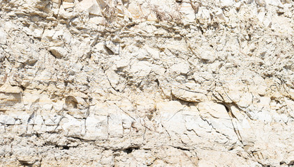 Rock formations on the slope of a cliff on the river Bank