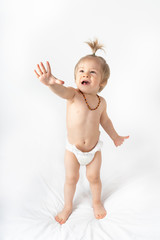 Blonde naked baby at studio shot