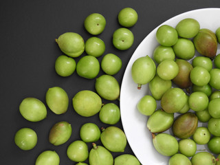 close-up shooting raw nectarine and sour plum,first sour fruits in spring,