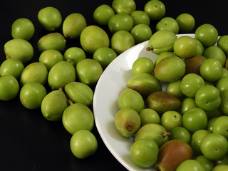 close-up shooting raw nectarine and sour plum,first sour fruits in spring,