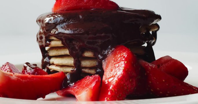 Decorated Pancakes With Milk Chocolate And Strawberry