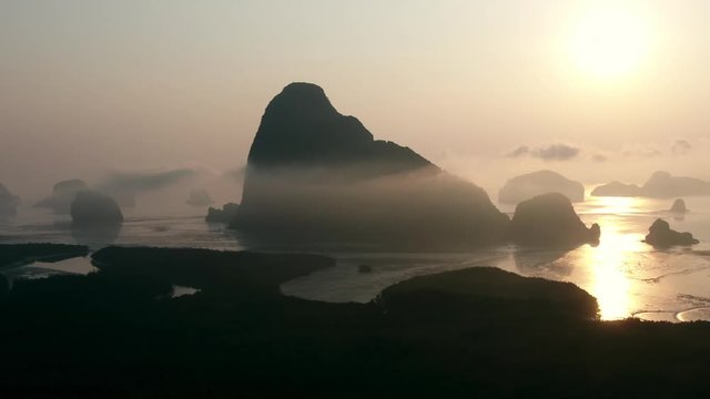 Right panning by Drone shot of Aerial view of Samet Nangshe with sunrise in Phang nga. slow motion movement of camera.