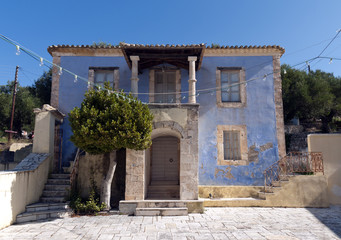 An old painted blue stone house on the island of Zakynthos, Greece.