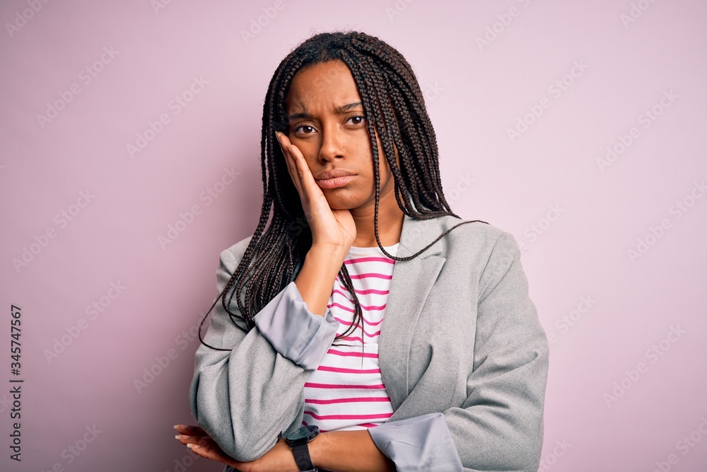 Canvas Prints Young african american business woman standing over pink isolated background thinking looking tired and bored with depression problems with crossed arms.