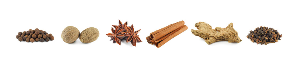 Set of dry spices isolated on white background: allspice, nutmeg, star anise, cinnamon sticks, dried ginger and clove side view