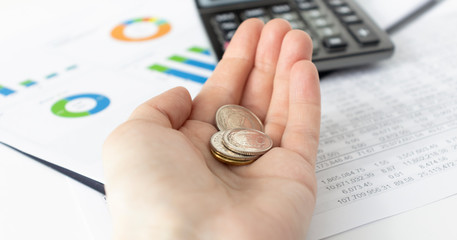 money and finances concept - close up of womans cupped hands showing euro coins