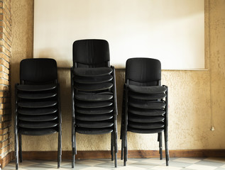 Stacked old and dirty office chairs
