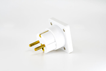 Close up view of a mains power travel adapter plug for European countries isolated against a plain white background.