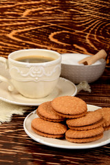 cookies next to a retro-style mug full of black coffee