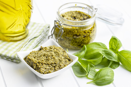 Green Basil Pesto Dip Sauce And Basil Leaves.