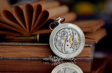 old pocket watch and book