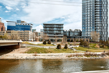 South Platte River surrounded by apartments and office buildings at Shoemaker Plaza in Confluence...