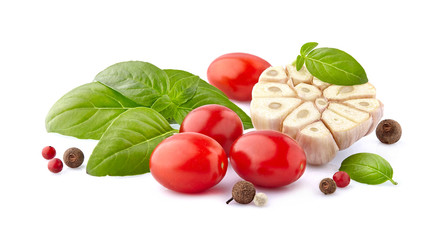 Fresh tomatoes with basil leaves, pepper and garlic  isolated on white background.