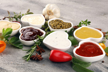 Sauces Assortment. Set of various sauces in bowls with ketchup, mayonnaise, pesto and mustard. Variety of induvidual marinades.