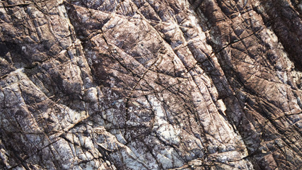 Stone texture, volcanic rock structure layers. geometric natural composition of different minerals in the stone. flat lines, unusual shape of the surface of volcanic rocks
