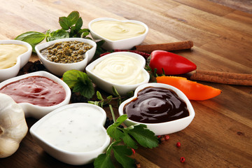 Sauces Assortment. Set of various sauces in bowls with ketchup, mayonnaise, pesto and mustard. Variety of induvidual marinades.