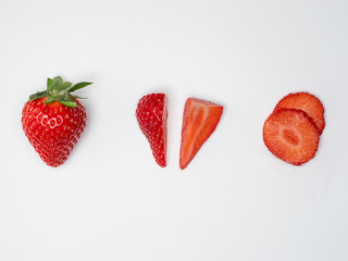 Set of fresh strawberries in knolling concept on white background