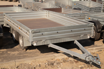 Car open trailer.A store that sells car trailers. Repair and maintenance of trailers for passenger cars.