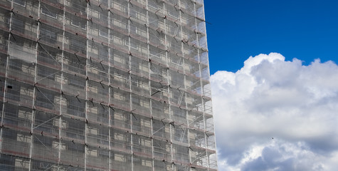 Scaffolding providing platforms for work in progress on a new apartment block