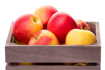 Apples in a wooden crate. Isolate on white background