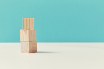Cubes stacking mockup, copy space for inscription or signs creative design. Pile of empty blocks on blue background
