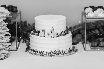wedding cake with roses and candles