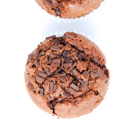 Chocolate birthday cupcakes with a cocoa frosting on top with dessert cutlery, on white background, horizontal