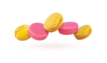French macaroons Multi-colored cookies on a white background. Colorful
macaroons are flying.
