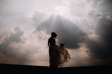 photo of a bride's silhouette in nature