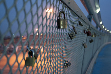 .padlocks on the bridge as a sign of eternal love