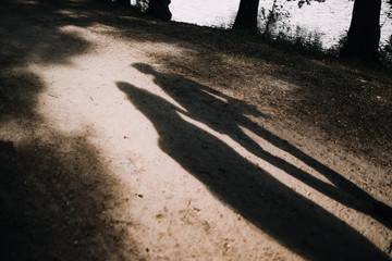 photo of married couples shadow on the floor