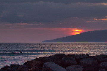 Distant telephoto view of Lanai from Maui at sunset.